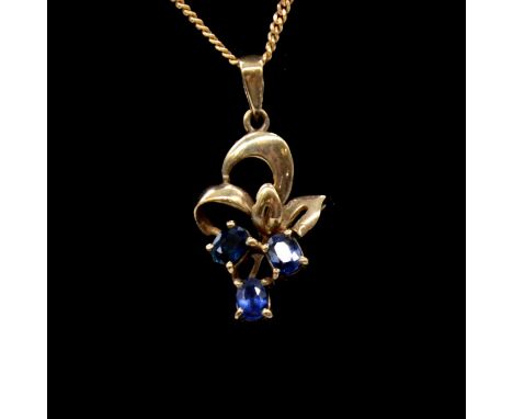 Two sapphire pendants and one gold chain, a 9 carat yellow gold pendant with three oval mixed cut sapphires on a flat trace l