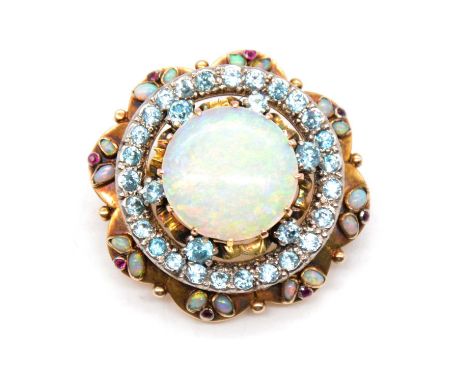 An opal, blue zircon and ruby circular target brooch, the central round cabochon cut opal, 16.5mm, surrounded by six blue zir