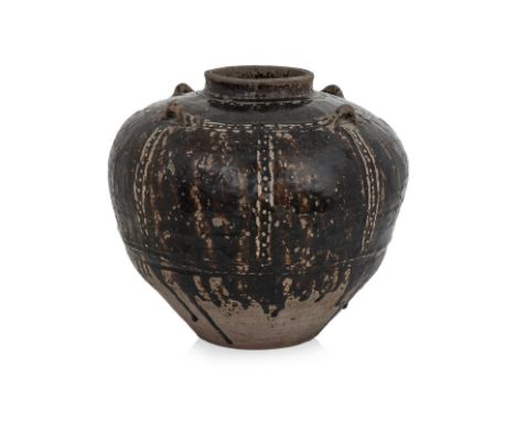 A BLACK GLAZED MARTABAN JAR Possibly Burmese, heavily potted, short necked with wide shoulders, four lugs, decorated with hor