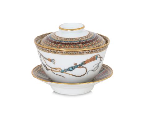 AN HERMÈS CHEVAL D’ORIENT TEA BOWL, COVER AND STAND
Featuring equestrian motifs, ornamental harnesses, and geometric borders 