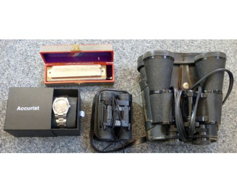 A boxed harmonica, a gents Tissot wristwatch and cased binoculars