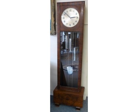 An Art Deco walnut longcase clock, the triple weight movement striking and chiming on twelve gongs, 188cm high