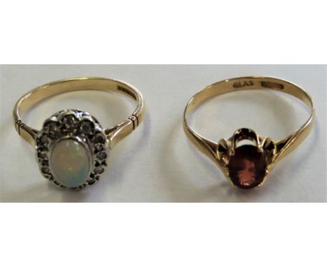 A 9ct gold opal and diamond cluster ring and a 9ct gold garnet single stone ring (2)