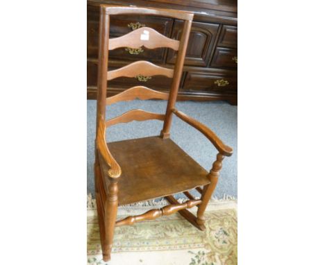 A Georgian style ash and fruitwood ladder back rocking chair