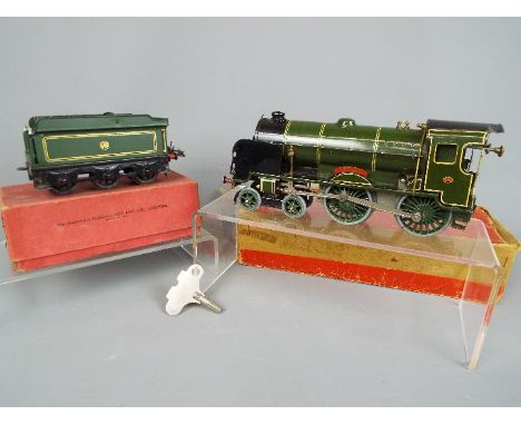 Hornby - A boxed Hornby tinplate 'O' Gauge 4-4-0 Clockwork Steam Locomotive Op.No.900 'Eton' in Southern Railway green livery