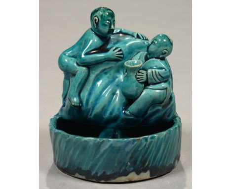 A CHINESE KINGFISHER GLAZED BRUSH WASHER IN THE FORM OF TWO FIGURES SEATED OR CLAMBERING ON A BOULDER, 12CM H, 20TH C  Good c