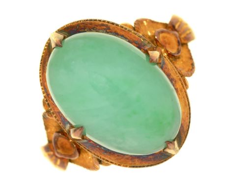 A JADE RING, IN GOLD, MARKED 14K, 6G, SIZE M  Good condition, jade with good polish