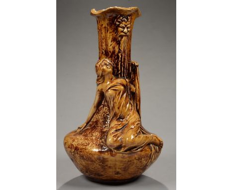 AN ART NOUVEAU CONTINENTAL OCHRE MAJOLICA FIGURAL VASE OF A NYMPH AND NEPTUNE WALL FOUNTAIN, 49CM H, INDISTINCT MOULDED MODEL