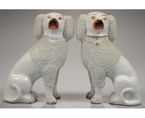 A PAIR OF STAFFORDSHIRE EARTHENWARE MODELS OF POODLES, 26CM H, C1860  Excellent examples in good condition, no cracks or chip