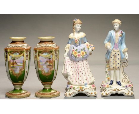 A PAIR OF NORITAKE GREEN GROUND VASES, MOULDED WITH SWAGS AND PAINTED WITH A LANDSCAPE IN RAISED GILT FRAME, 15.5CM H, PRINTE