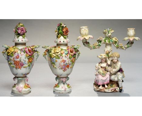 A PAIR OF SITZENDORF FLORAL ENCRUSTED POT POURRI VASES AND COVERS OF PEAR SHAPE AND PRINTED AND PAINTED WITH FLOWERS, 23CM H,