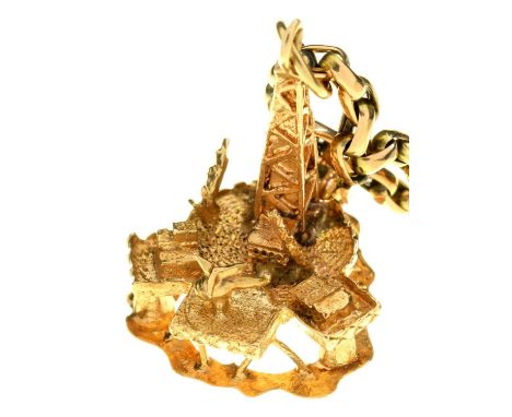 A GOLD NECKLET, MARKED 9C AND A 9CT GOLD TOWER CHARM, 12.3G  Chain with light wear, charm in good condition