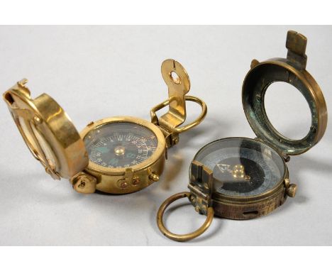 A BRITISH MILITARY ISSUE WORLD WAR ONE BRASS PRISMATIC COMPASS BY NEWTON AND WRIGHT LIMITED AND ANOTHER  The first with much 