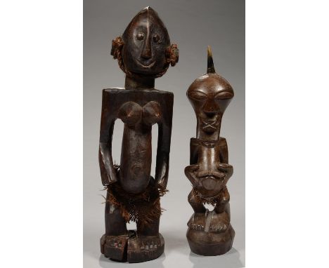TRIBAL ART. TWO AFRICAN CARVED WOOD AND FIBRE FIGURES, THE HEAD OF THE SMALLER FIGURE SURMOUNTED BY A HORN, 38 AND 45CM H  Sh