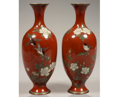 A PAIR OF JAPANESE RED GROUND CLOISONNE ENAMEL OVOID VASES DECORATED WITH FINCHES AND FLOWERS, 24CM H, MEIJI PERIOD  One vase