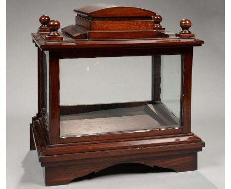 A MAHOGANY TABLE TOP DISPLAY CABINET, WITH STEPPED, DOMED PEDIMENT AND BALL FINIALS, ON BRACKET FEET, 41CM H; 38 X 25CM&nbsp;