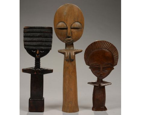 TRIBAL ART. THREE AFRICAN CARVED WOOD DOLLS, 27 - 40CM H  Light wear and scratches, in basically good overall condition