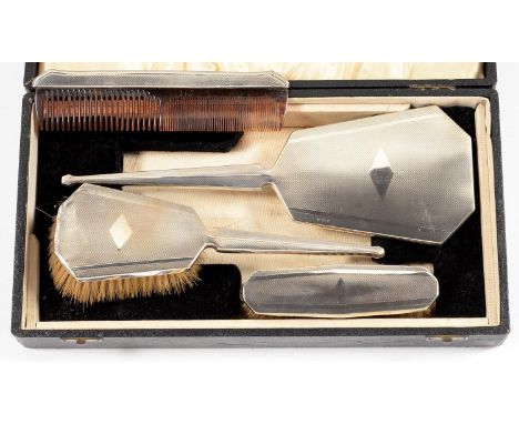 A GEORGE V FOUR PIECE SILVER BRUSH SET, ENGINE TURNED, MAKER B &amp; CO, BIRMINGHAM 1932, CASED  Minor dents and wear, case s