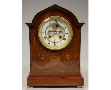 AN INLAID MAHOGANY MANTEL CLOCK, WITH OGEE ARCHED CORNICE, THE FRENCH BELL STRIKING MOVEMENT WITH ENAMEL DIAL AND BROCOT ESCA