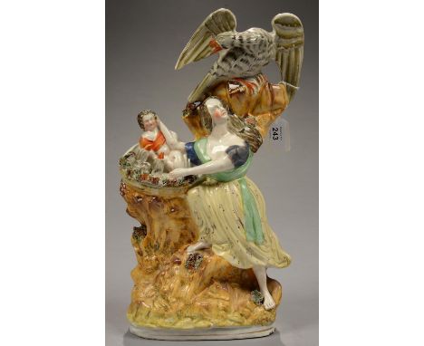 A STAFFORDSHIRE FLATBACK EAGLE AND CHILD GROUP, 40CM H, C1860  One or two minor chips around base and slight flaking of the e