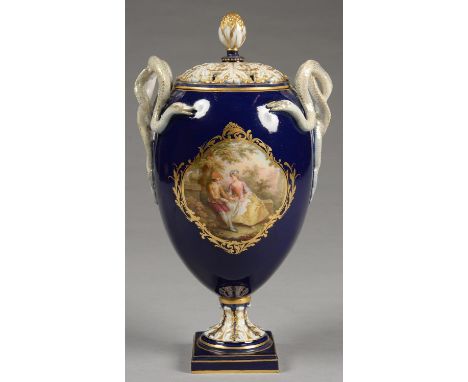 A MEISSEN OVIFORM VASE AND PIERCED COVER, WITH ENTWINED SERPENT HANDLES, THE VASE PAINTED TO EITHER SIDE WITH LOVERS IN A LEA