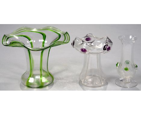 AN ART NOUVEAU STUART GLASS VASE WITH GREEN PEACOCK TRAILED DECORATION, A SIMILAR SMALLER POSY VASE AND ANOTHER OF TAPERED FO