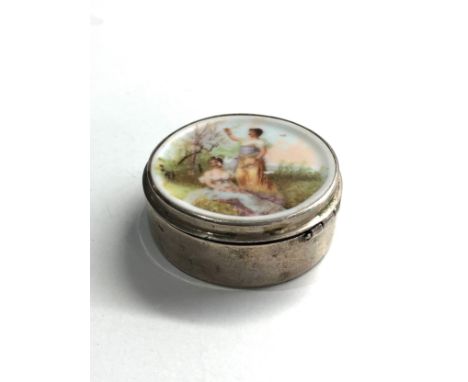 Continental silver painted porcelain panel top pill box xrt tested as silver measures aprrox 4.5cm dia height 1.7cm 