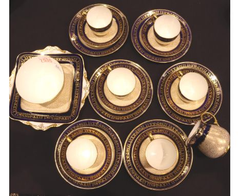 Paragon twenty one piece tea service decorated in blue and gilt. No cracks, chips or visible restoration. No apparent crazing
