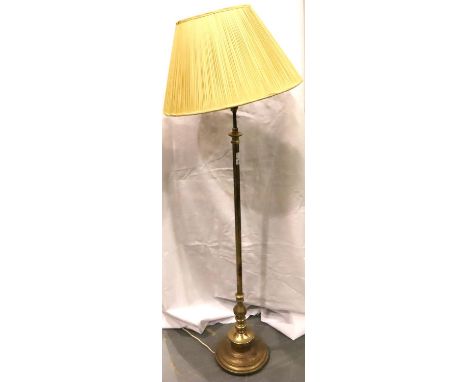 A 20th century brass standard lamp with weighted circular base, H: 128 cm. Not available for in-house P&P, contact Paul O'Hea