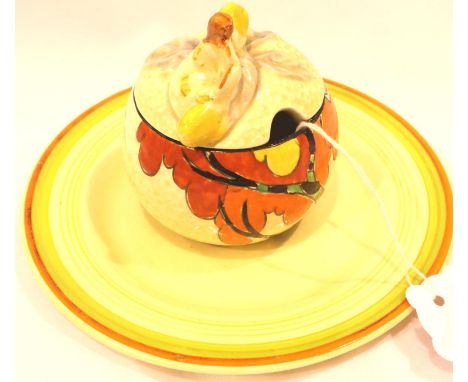 Clarice Cliff; a Bizarre painted preserve pot in the Fantasque pattern with matched cover, together with a Bizarre plate, D: 