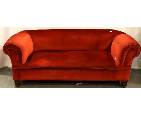 An early 20th century drop-end sofa, upholstered in red velour withy mahogany frame, 175 x 80 x 65 cm H. Not available for in