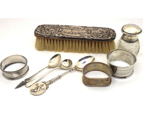 Collection of mixed household silver including three napkin rings, smelling salts bottle, three spoons and a silver back brus