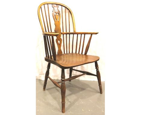 A late 18th century elm Windsor chair, stick back with turned supports and bobbin elbow supports. Not available for in-house 