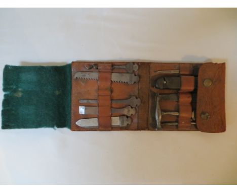 A WWII miniature Bonsa / Bonanza German military tool kit in leather pouch. 1x tool missing.
