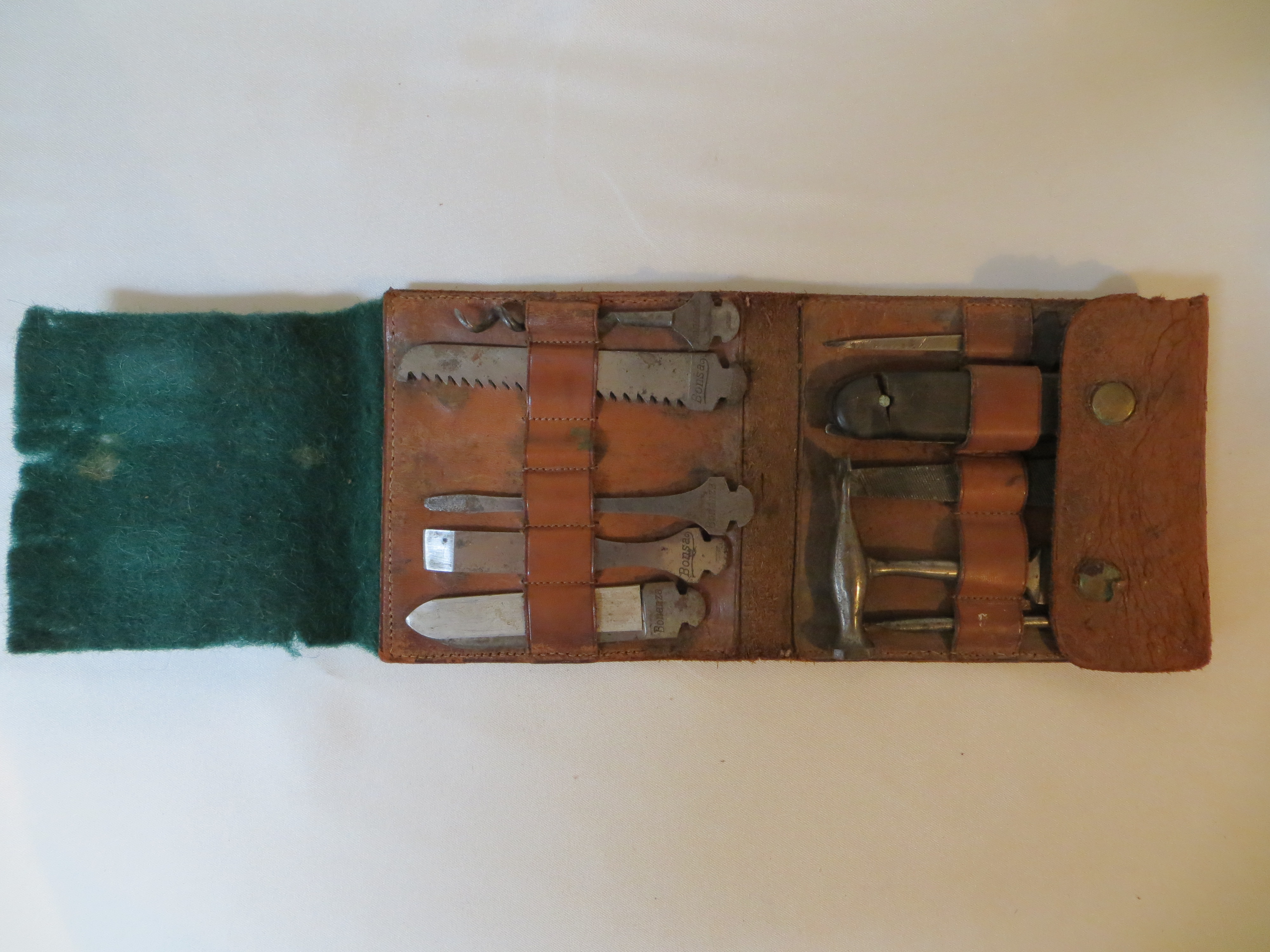 A WWII miniature Bonsa / Bonanza German military tool kit in leather