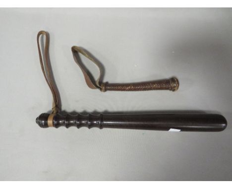 A vintage lignum vitae truncheon together with a leather fishing priest 