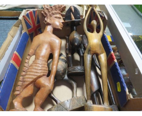Five various African tribal art carved figures including two Senufo Ivory Coast carved figures - one with large fangs, an Eas