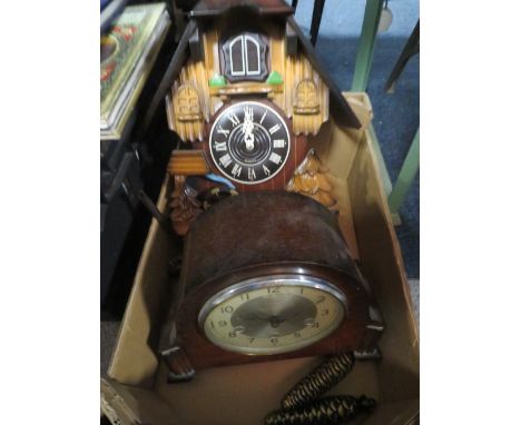 An oak cased Smiths mantle clock together with a quartz cuckoo clock 