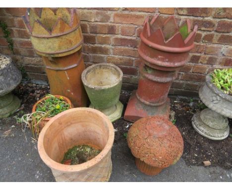 A selection of terracotta garden planters and ornaments, to include two castellated chimney pots