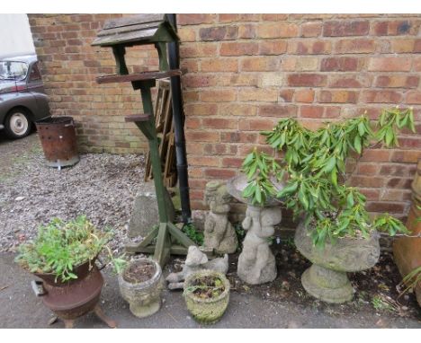 A selection of concrete planters and garden ornaments 