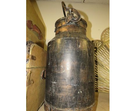 A large metal milk churn 