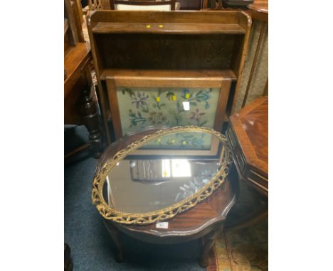 A oak open bookcase, glazed fire screen, oval mirror and occasional table. (4)