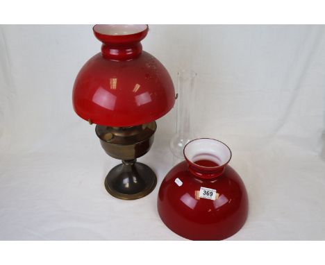 Brass Oil Lamp with funnel and Red & White glass shade, plus another similar shade