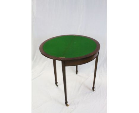 19th century Mahogany Demi-Lune Fold Out Card Table with green baize inset playing surface raised on four square tapering leg