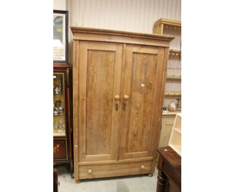 Pine Wardrobe with Two Panel Doors opening to reveal shelf and hanging rail above a single drawer