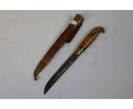 Finnish cork handled hunting knife, blade marked m"made in Finland" with leather and brass mounted scabbard