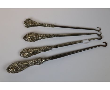 Four silver handled button hooks with repousse foliate decoration, to include makers H V Pithey & Co, Birmingham 1907 (4)