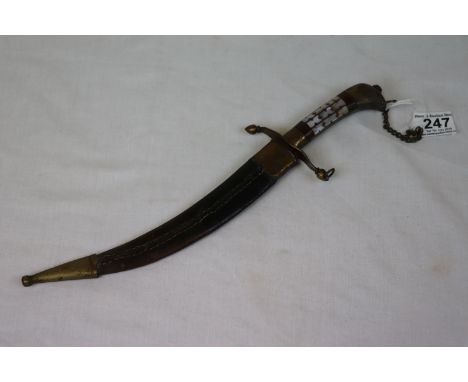 Middle Eastern curved knife with brass mounted leather scabbard with mother-of-pearl decorative handle