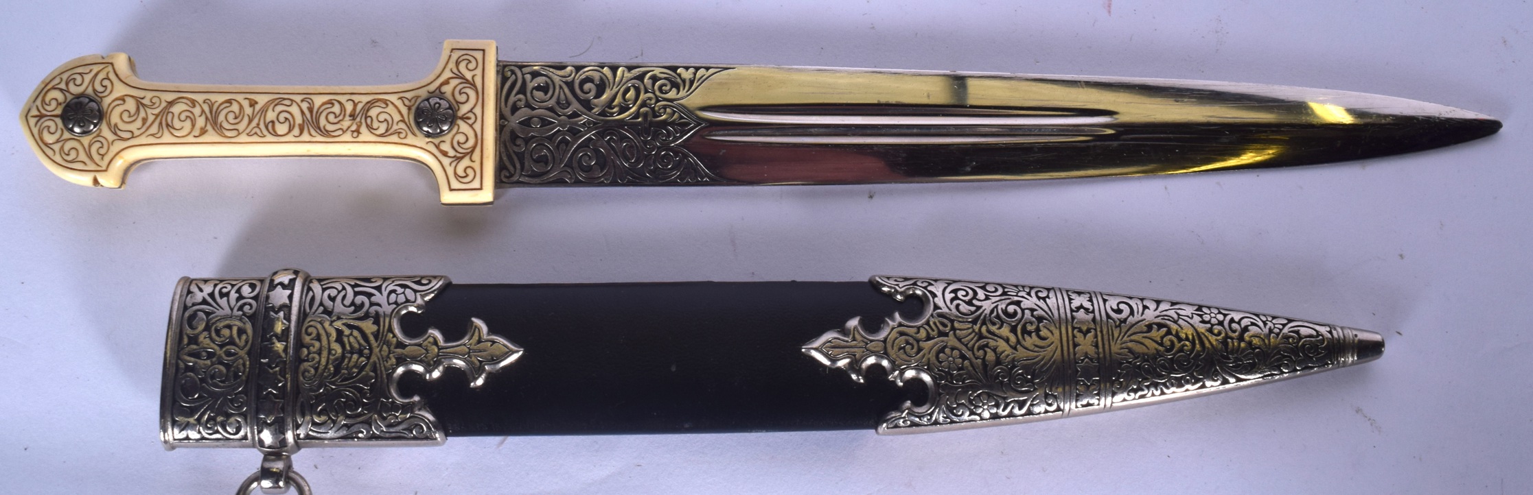 A MID 20TH CENTURY BONE HANDLED DAGGER, engraved with foliage. 42.5 cm ...