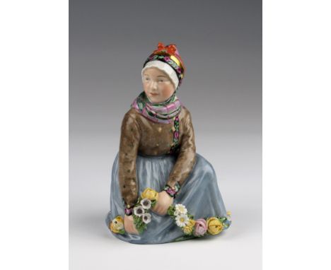 Royal Copenhagen figurine, no. 12413 (Fano /Faro), depicting a girl picking flowers, height 14cm approx.